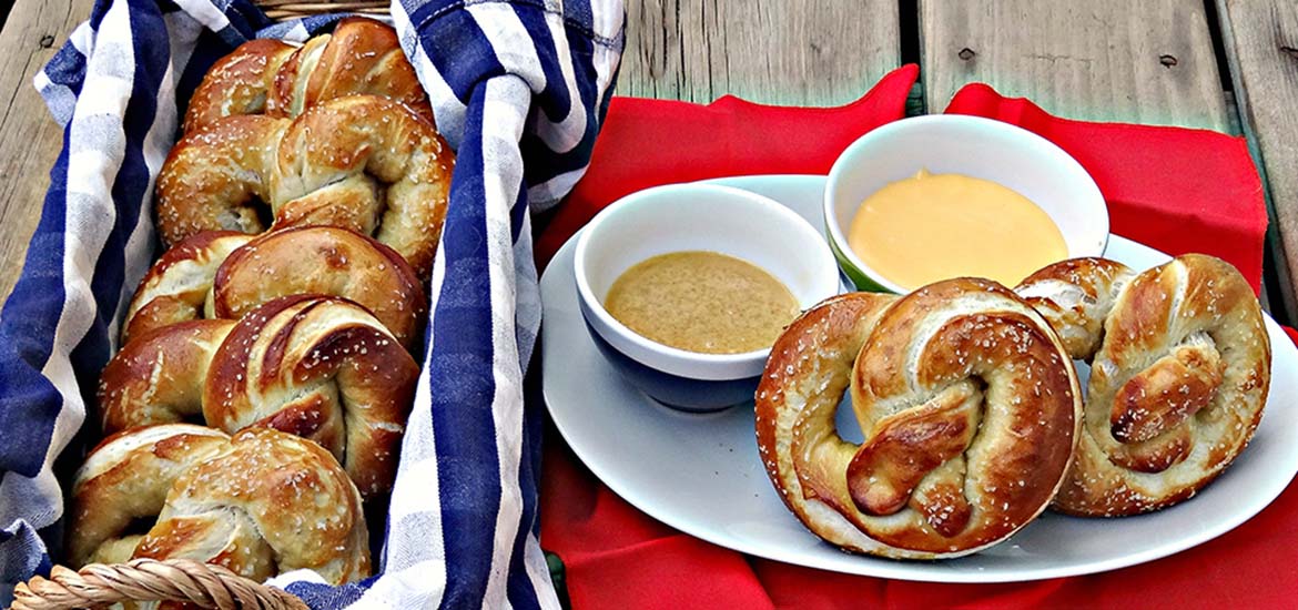 Hot pretzels with cheese and mustard dipping sauces