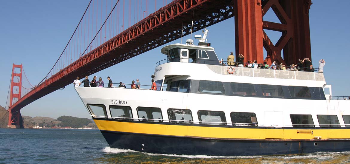 Blue & Gold Fleet boat going under the Golden Gate Bridge