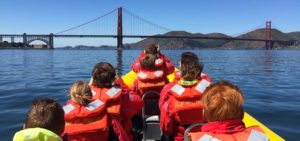 People on Bay Voyager looking at the Golden Gate Bridge