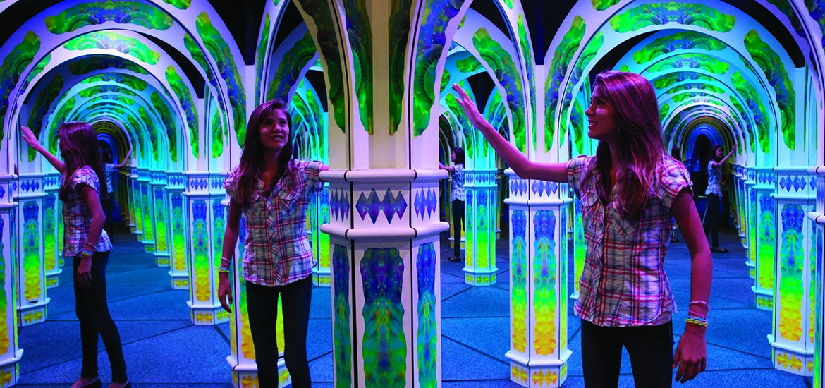 Inside the Mirror Maze with girl exploring