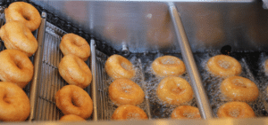 Hot mini donuts being fried