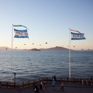 PIER 39 Flags with the San Francisco Bay in the background